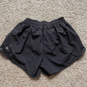 Black lulu lemon hotty hot high-rise lined shorts. Size 6